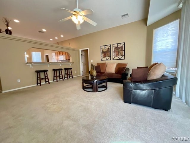 living area with baseboards, a ceiling fan, lofted ceiling, carpet, and recessed lighting