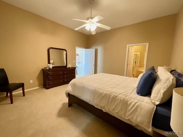 bedroom with a ceiling fan, light carpet, connected bathroom, and baseboards