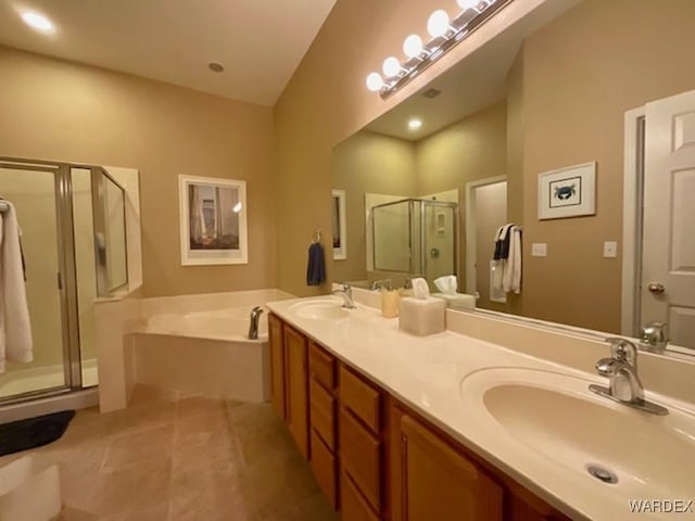 full bath with double vanity, a sink, a shower stall, tile patterned flooring, and a bath