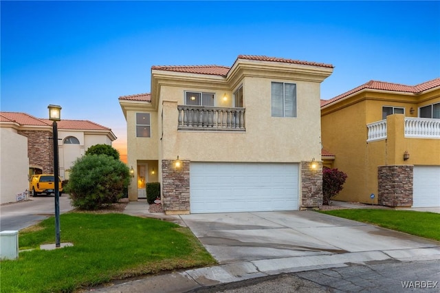 mediterranean / spanish-style house featuring a garage, stone siding, concrete driveway, and stucco siding