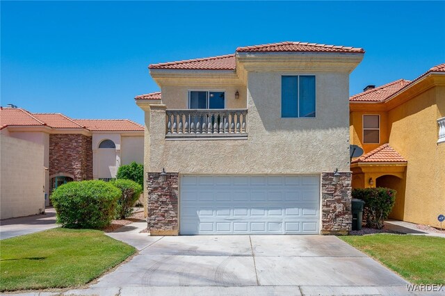 mediterranean / spanish-style home featuring an attached garage, a balcony, a tile roof, stone siding, and stucco siding