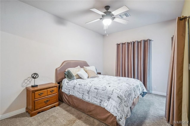 bedroom featuring light carpet, a ceiling fan, visible vents, and baseboards