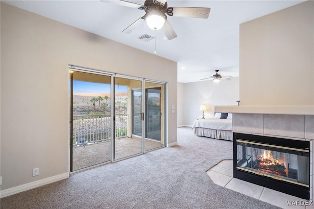 bedroom featuring baseboards, access to outside, visible vents, and light colored carpet