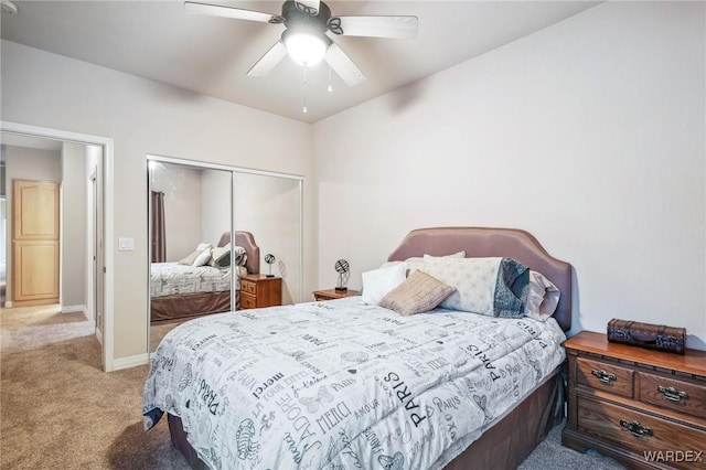 bedroom with ceiling fan, baseboards, a closet, and light colored carpet