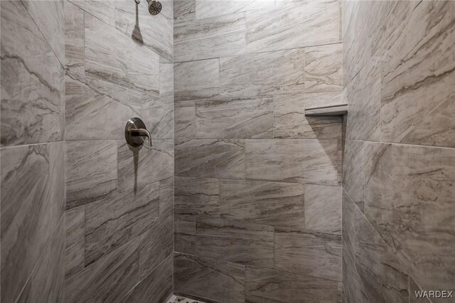 full bath featuring tiled shower