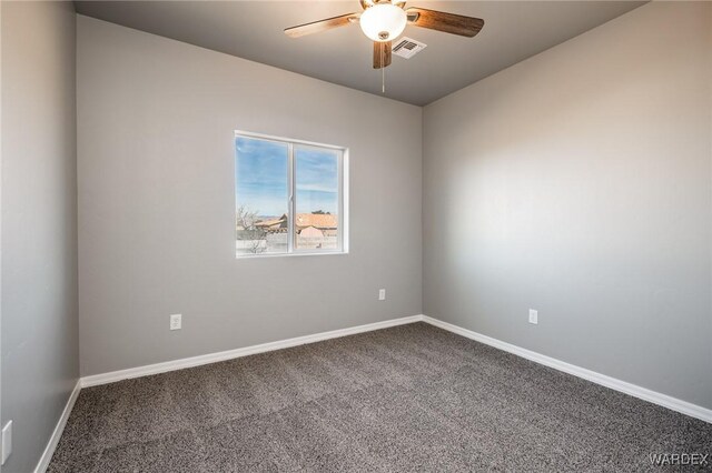 unfurnished room with ceiling fan, carpet, visible vents, and baseboards