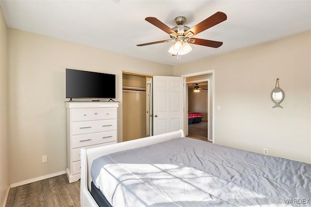 bedroom with a ceiling fan, a closet, baseboards, and wood finished floors