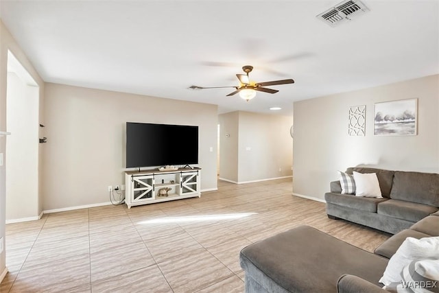 living room featuring ceiling fan, visible vents, and baseboards