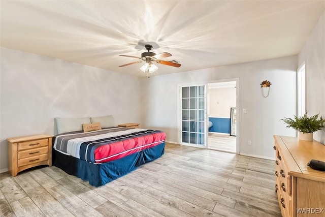 bedroom featuring light wood-style floors, ceiling fan, and baseboards