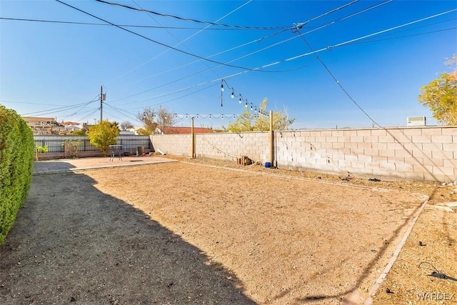 view of yard with a patio area and a fenced backyard