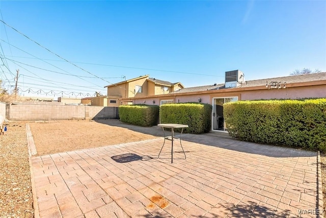 view of patio featuring a fenced backyard and central AC unit