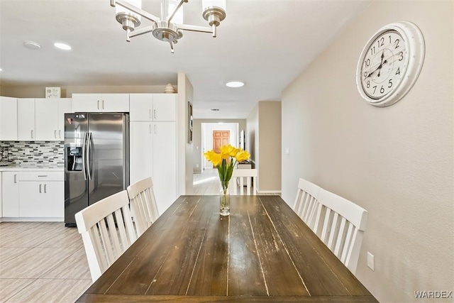 unfurnished dining area with a notable chandelier