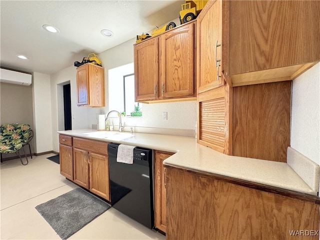 kitchen with a sink, black dishwasher, a wall mounted air conditioner, and light countertops