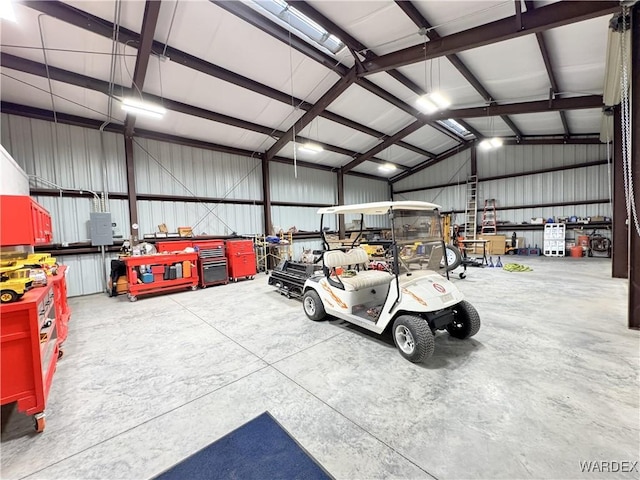 garage featuring a workshop area and metal wall