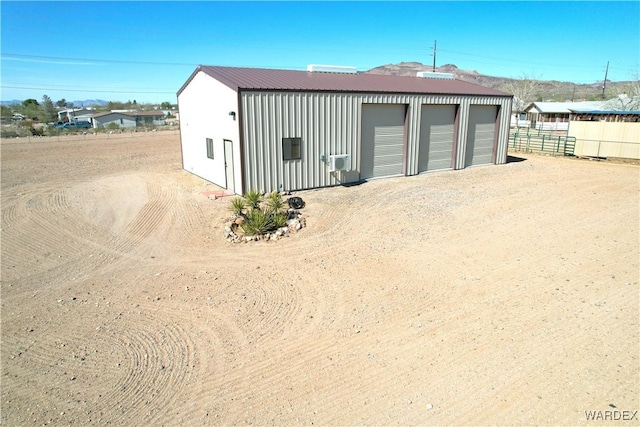 detached garage with fence