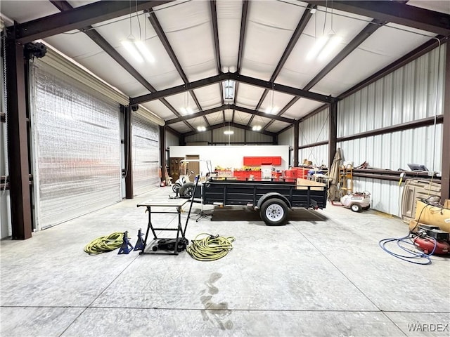 garage featuring a workshop area and metal wall