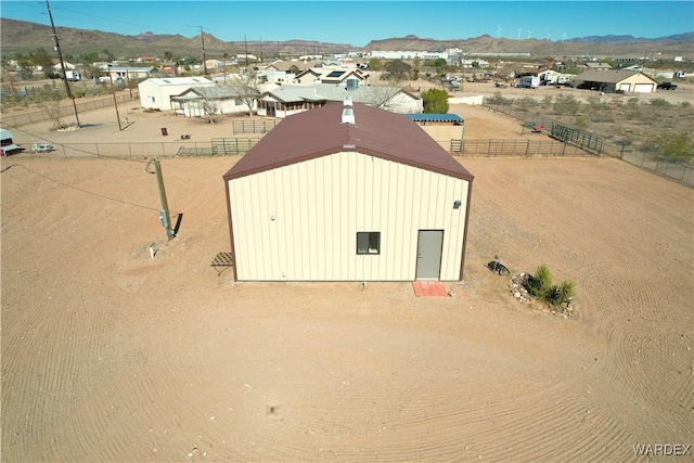 birds eye view of property featuring a mountain view