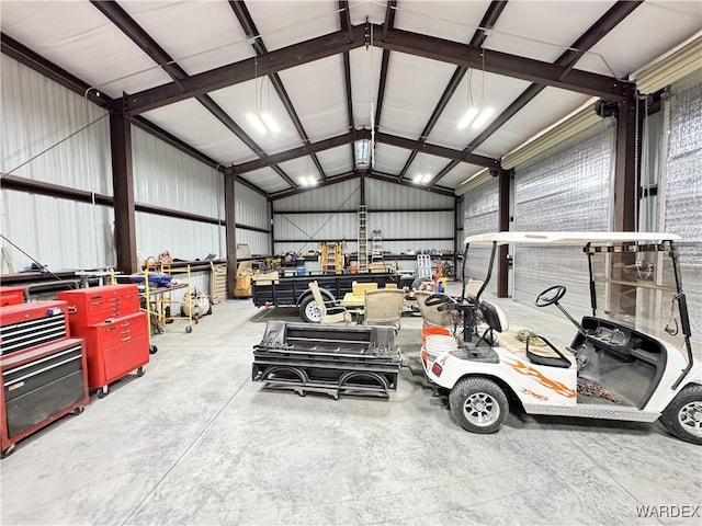 garage featuring metal wall and a workshop area