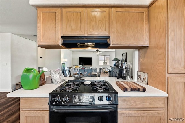 kitchen featuring range hood, light countertops, black range with gas cooktop, and ceiling fan