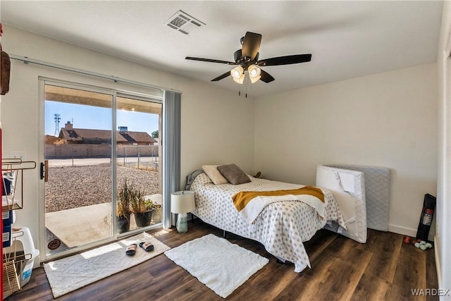 bedroom with access to exterior, visible vents, dark wood finished floors, and ceiling fan