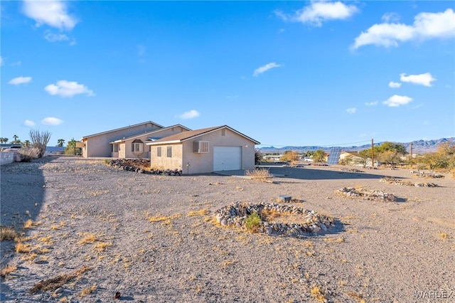 ranch-style house with driveway and an attached garage