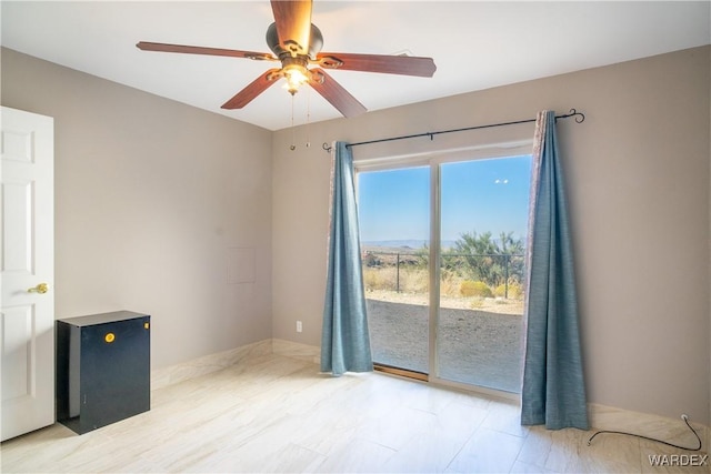 unfurnished room with ceiling fan