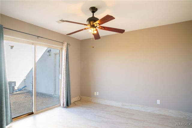 empty room featuring baseboards, a wealth of natural light, and a ceiling fan