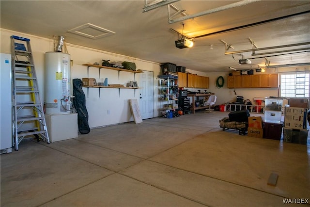 garage featuring water heater and a garage door opener