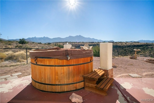 exterior space featuring fence and a mountain view