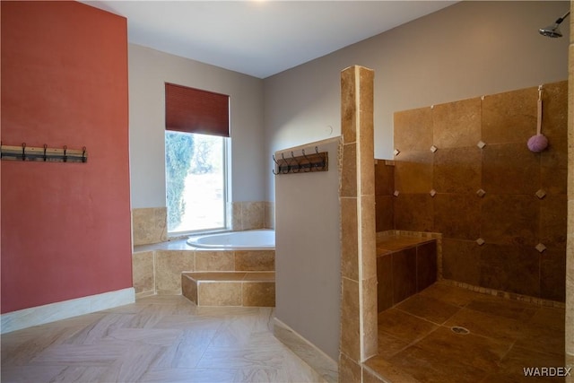 bathroom featuring a bath and a walk in shower