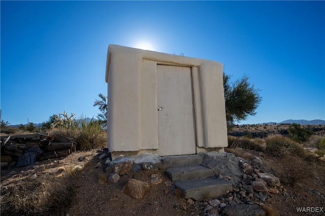 view of storm shelter with a mountain view