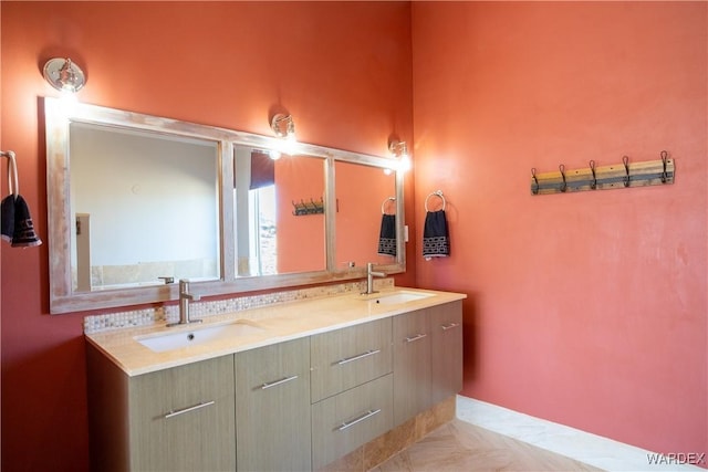 bathroom with double vanity and a sink