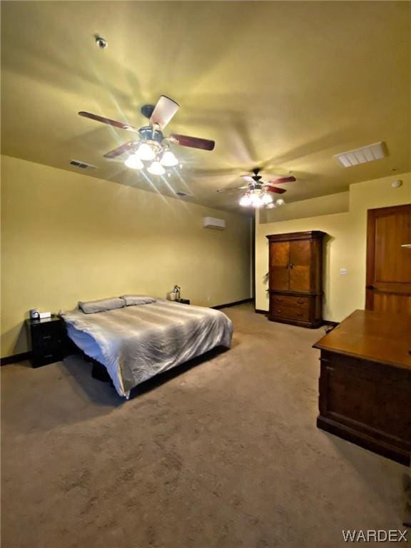 bedroom featuring a ceiling fan, visible vents, and light carpet