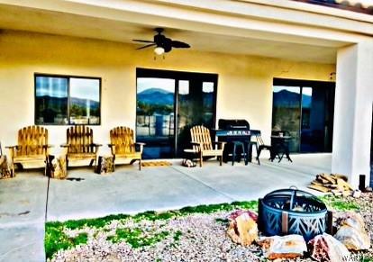 view of patio / terrace featuring a mountain view and a ceiling fan