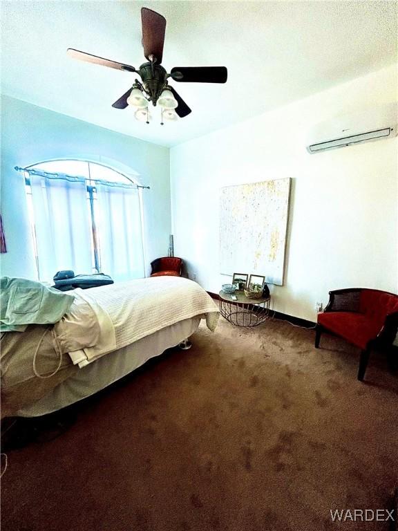 unfurnished bedroom featuring carpet floors and a ceiling fan