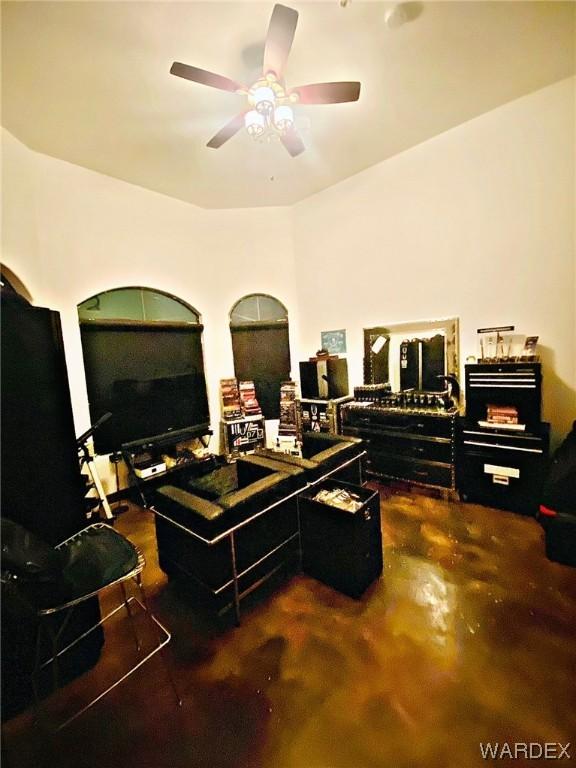 office area with finished concrete flooring and ceiling fan