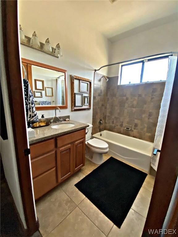 full bathroom with shower / bathtub combination with curtain and tile patterned floors