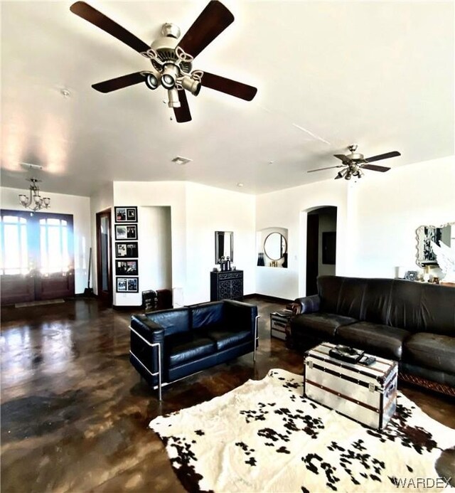 living room with a glass covered fireplace and visible vents