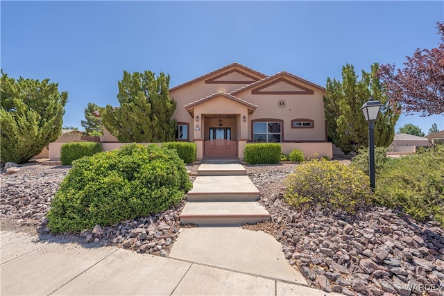 view of front of home featuring stucco siding