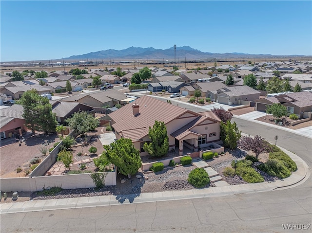 birds eye view of property with a residential view and a mountain view