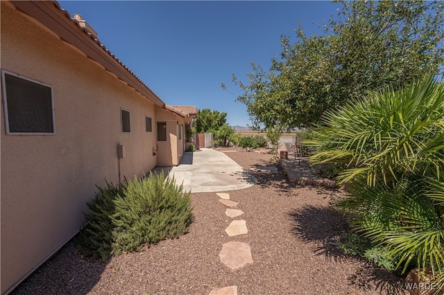 view of yard with a fenced backyard and a patio