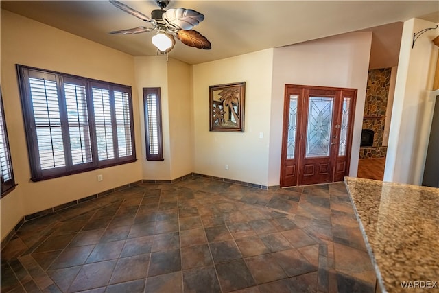 entryway featuring a ceiling fan