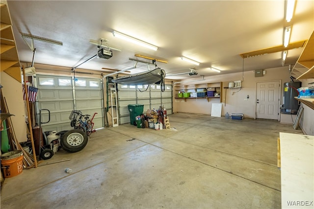 garage with water heater and a garage door opener