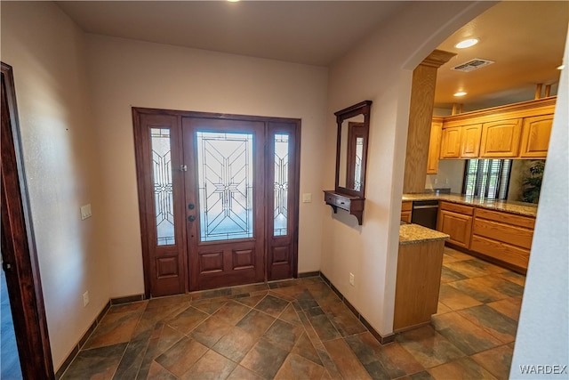 entryway featuring baseboards, visible vents, and recessed lighting