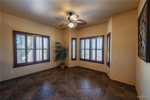 spare room with ceiling fan