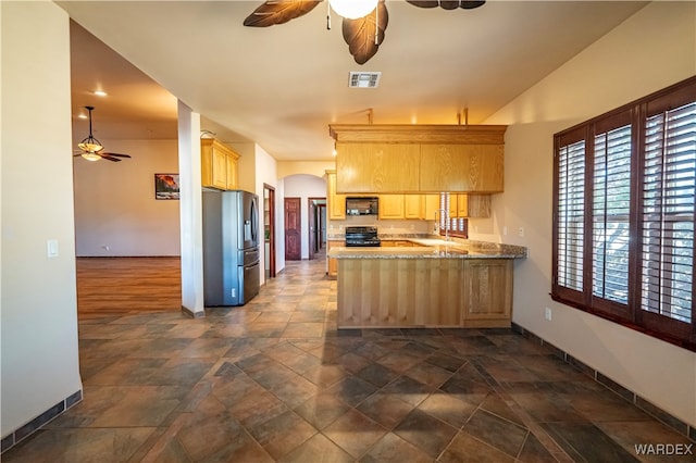 kitchen with visible vents, electric range oven, black microwave, a peninsula, and stainless steel fridge with ice dispenser