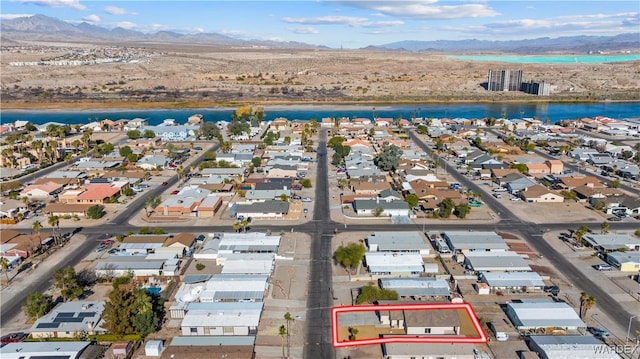 bird's eye view featuring a residential view and a water and mountain view