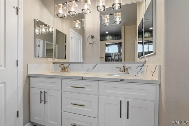 bathroom featuring double vanity and a sink