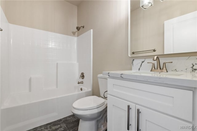 full bathroom with toilet, bathtub / shower combination, and vanity