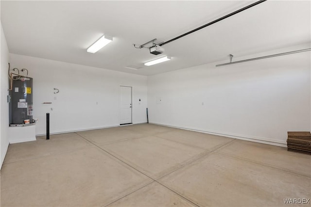 garage featuring a garage door opener and water heater